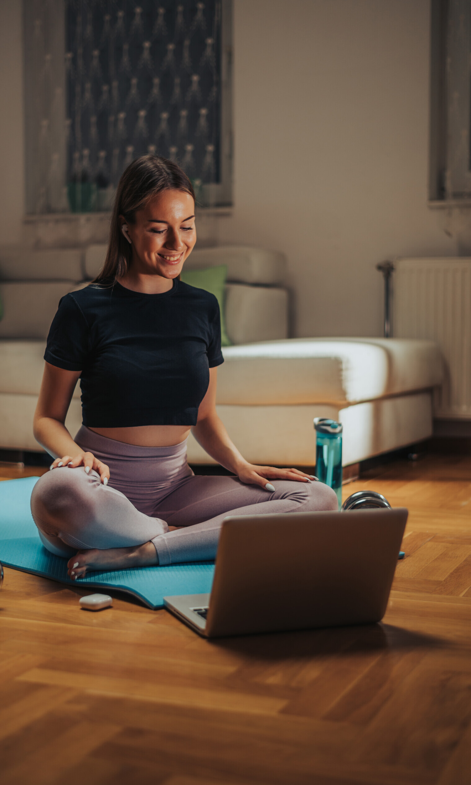 Woman recording her online training while using laptop at home